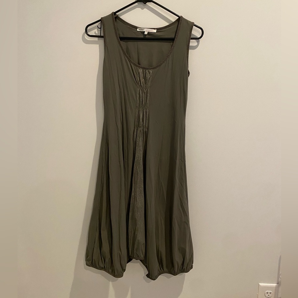 Olive green dress with asymmetrical hem.